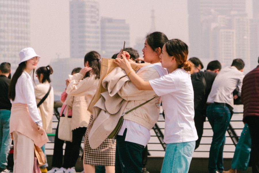 Two young Asian women taking selfie in Shanghai